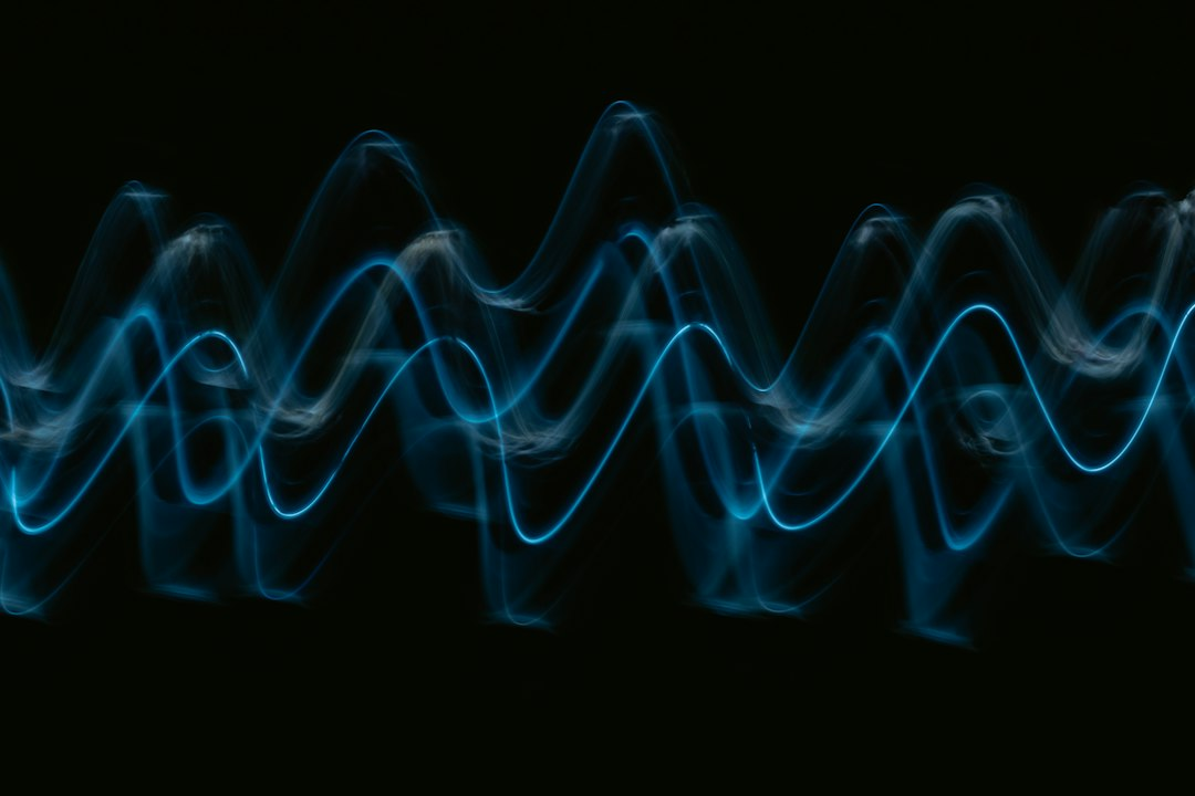 A blue digital audio waveform representing an AI-cloned voice