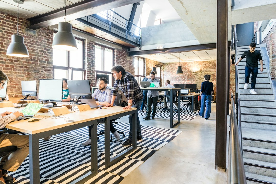 Editorial colleagues collaborating in a modern workspace