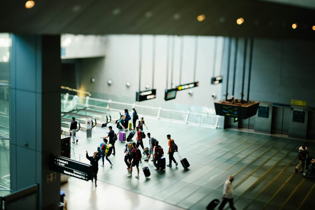 Travelers walking through an airport terminal
