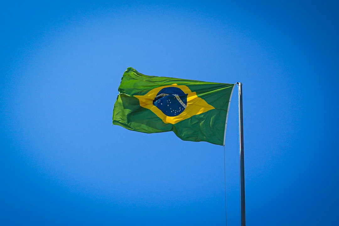 Brazilian flag flying outdoors, illustrating Brazil-U.S. trade negotiations