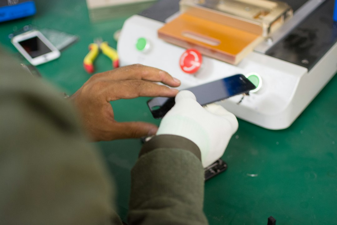 A smartphone being inspected and repaired