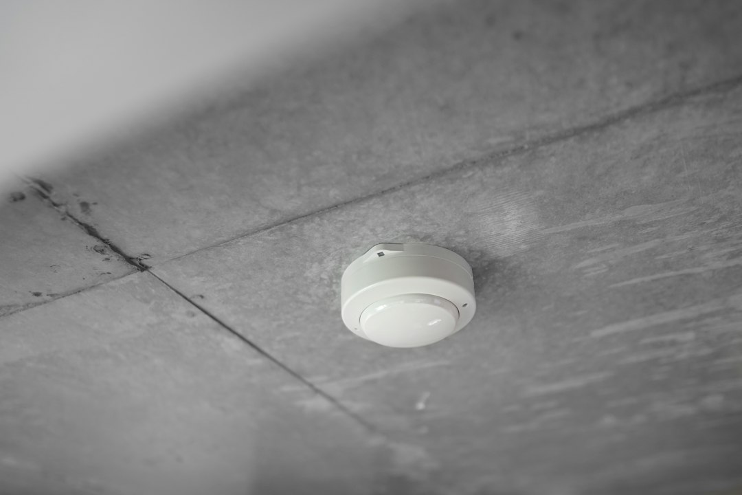 Ceiling-mounted alarm in a home; illustrative image for a smoke alarm safety checklist