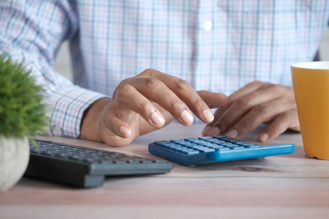 Person using a calculator to review finances