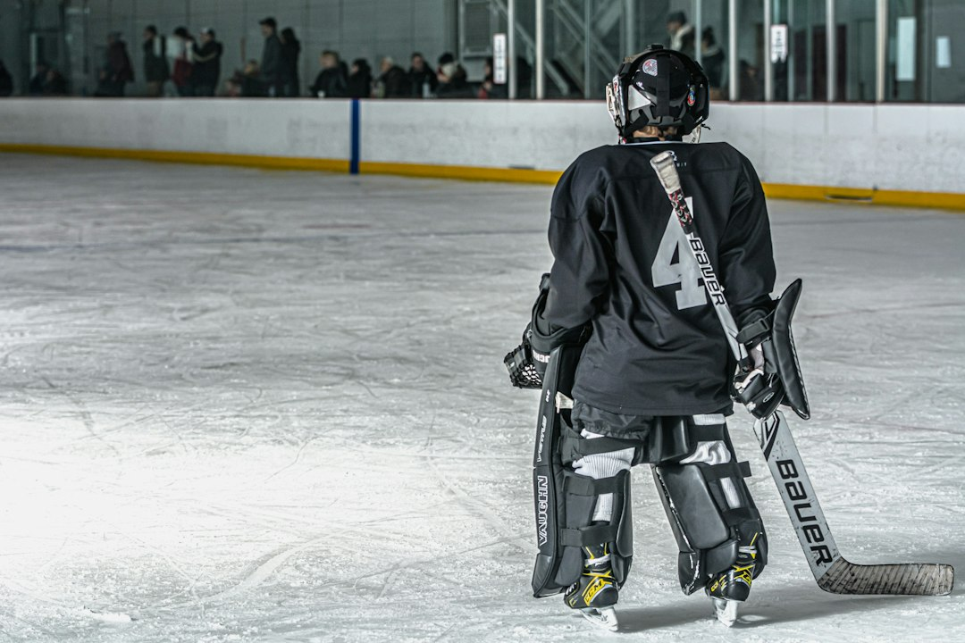 Hockey goalie waiting in front of a net during an unrelated game