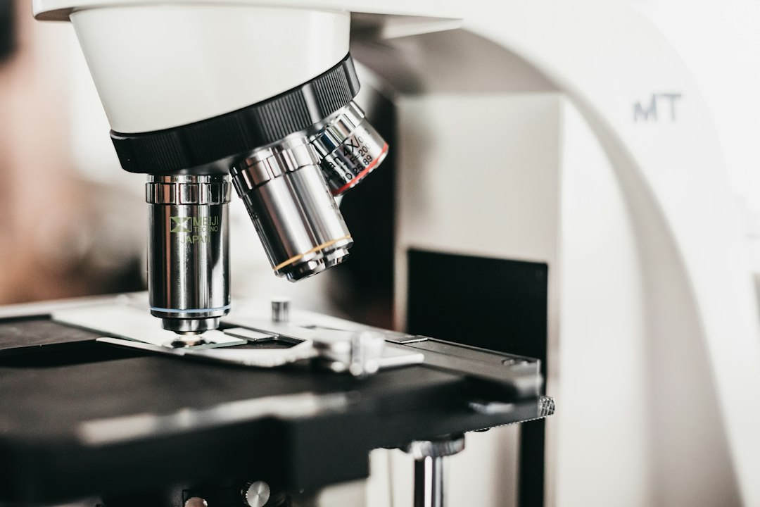Close view of a microscope above its stage; illustrative public health image