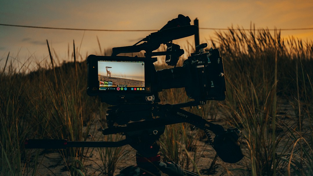 Black video camera on a tripod; illustrative image, not a Confabulation production still