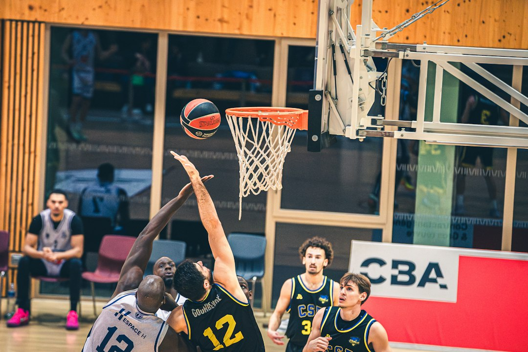 Basketball players near the hoop