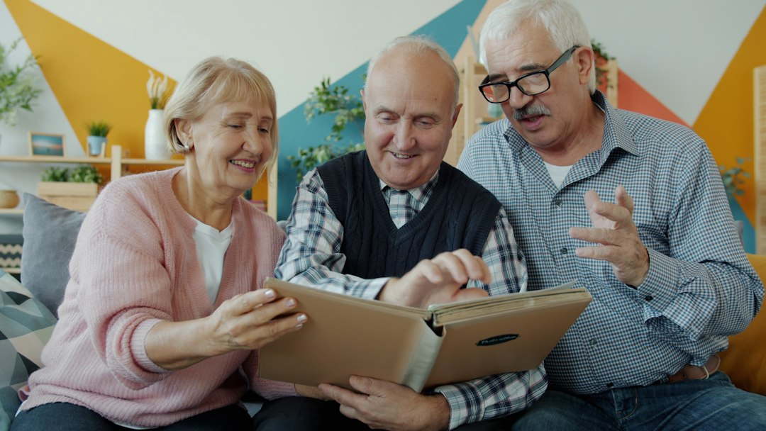 Older adults sitting together and reviewing a photo book
