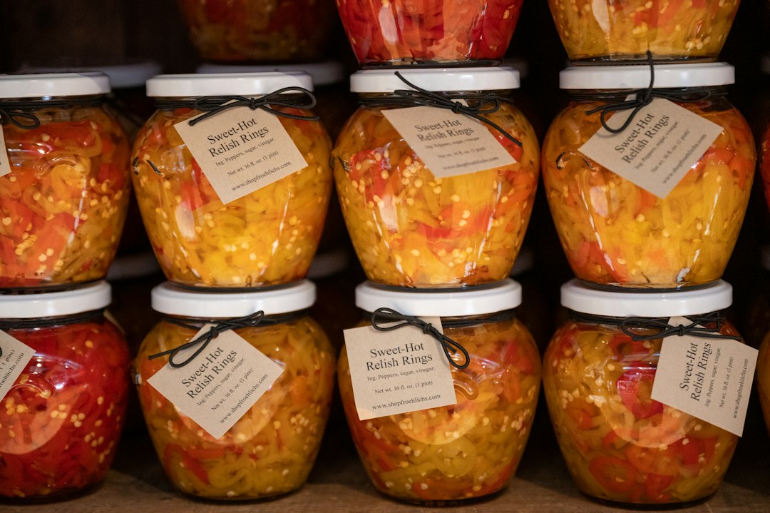 Jars of pickled vegetables on a shelf, illustrating the Mezzetta peperoncini recall