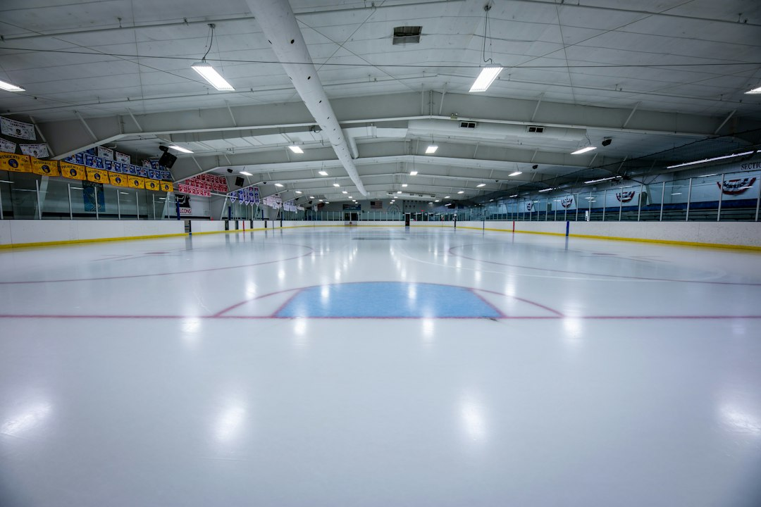 Indoor ice hockey rink with a goal at one end