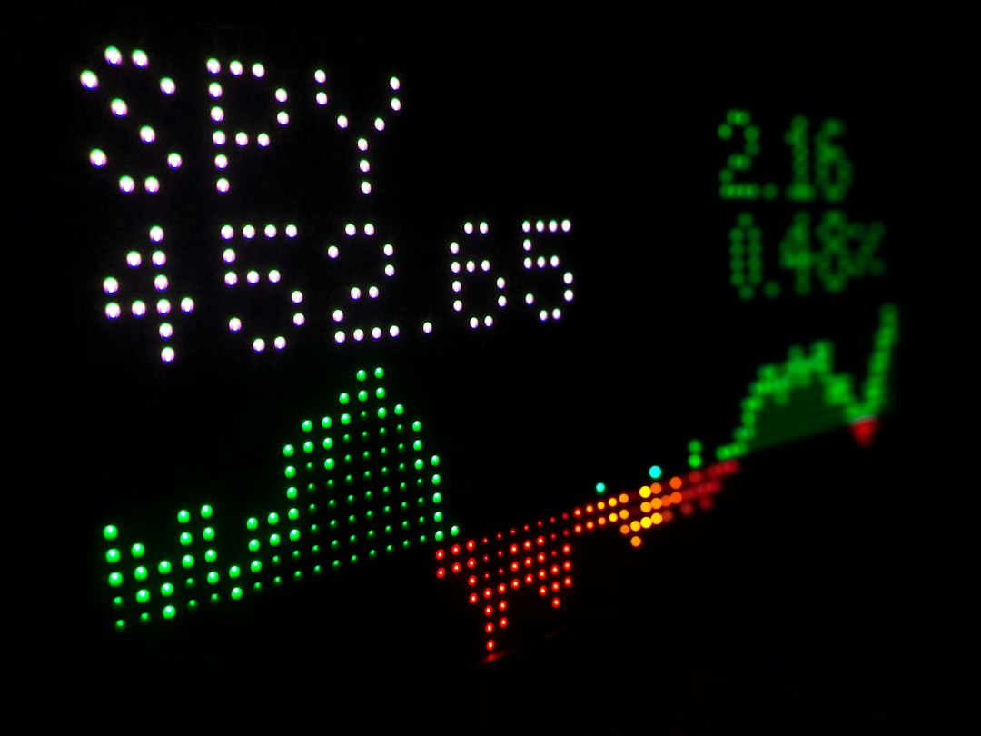 Digital screen displaying financial market charts and prices