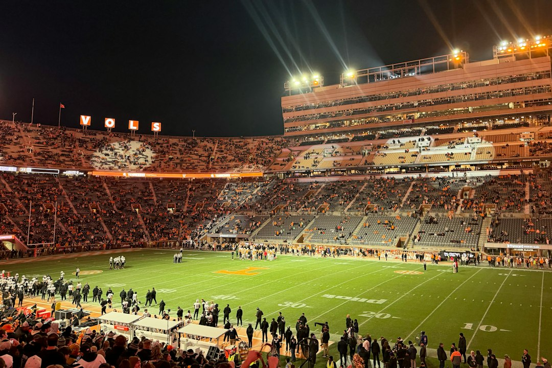 College football stadium under bright lights illustrating the October 4 AP Top 25 rankings