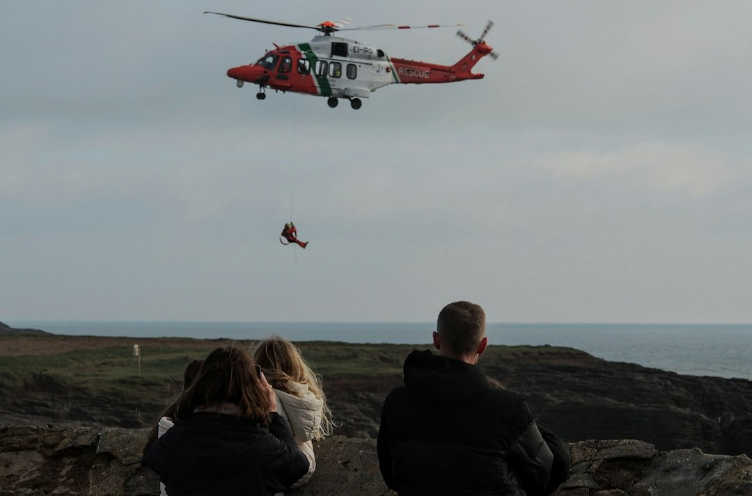 Coast Guard helicopter conducting an ocean rescue training exercise, used illustratively