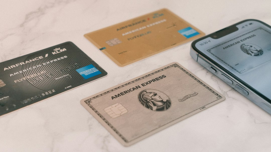 Credit cards beside a smartphone, illustrating payment and financial compliance