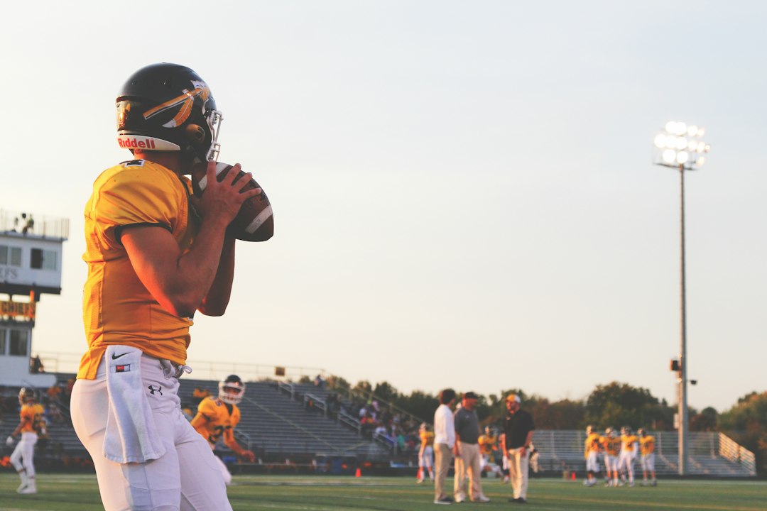 American football player holding a ball, illustrating an NFL trade