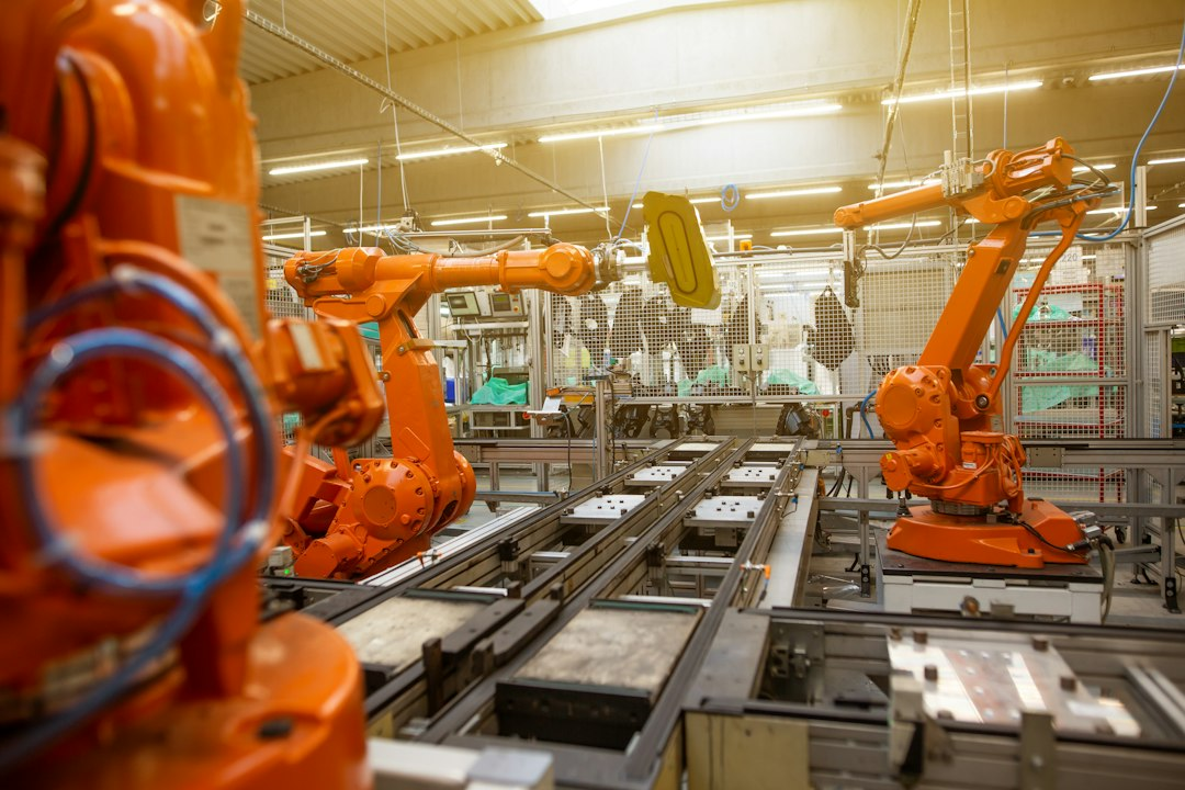 Illustrative automated manufacturing robots in a modern factory