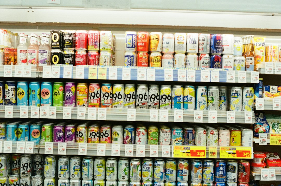 Colorful beverage cans displayed on a grocery store shelf, illustrating the 7UP recall report