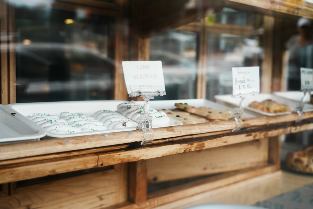 Loaves and baked goods displayed on a wooden shelf