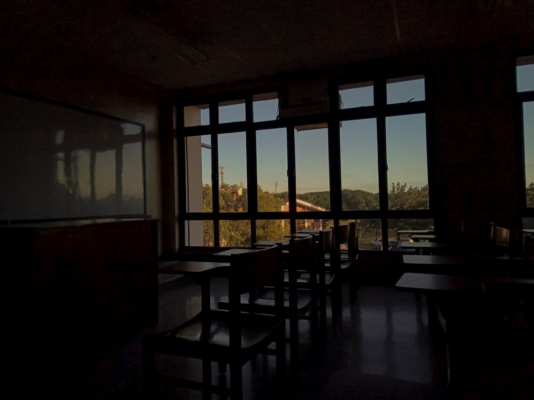 Illustrative empty classroom with desks and chairs