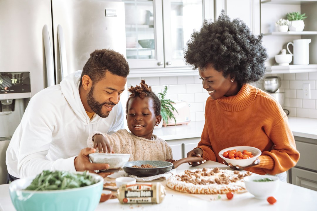 A couple reviewing household finances at a kitchen table