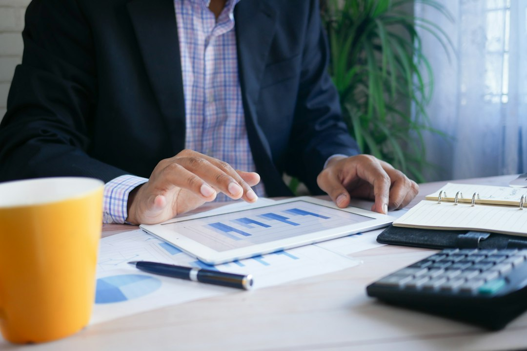 Financial professional reviewing information on a tablet