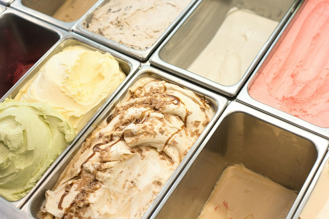 Assorted ice cream flavors in a chilled display case