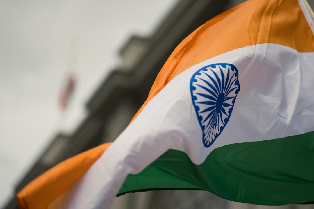 People waving Indian flags at a public rally, used illustratively for India election-roll protests
