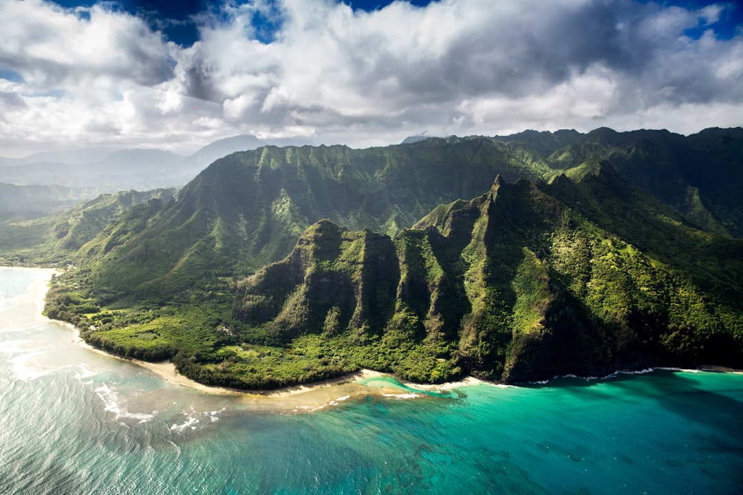 Clouds over Kauai’s green mountains and tropical coast