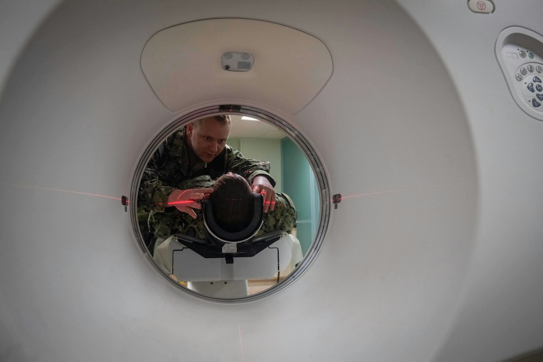 Medical professional demonstrating radiology imaging equipment