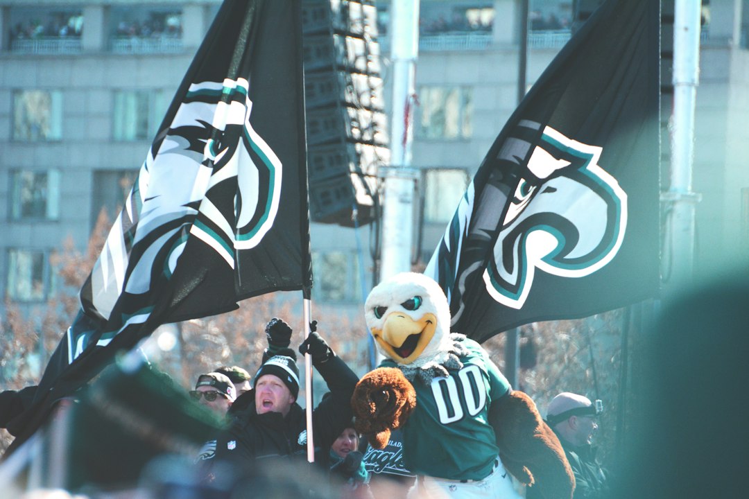 Illustrative Philadelphia football flags outside a stadium