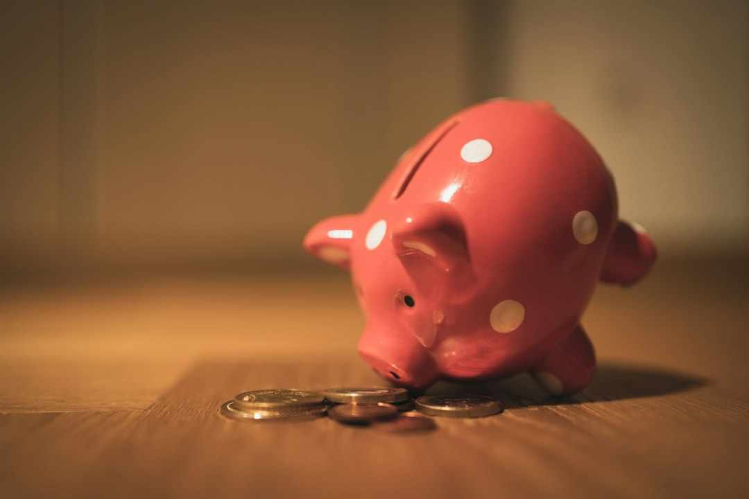 Piggy bank with coins, illustrating automatic Trump Account enrollment for children