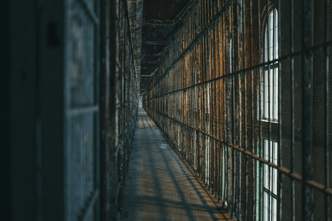 Dimly lit prison corridor, illustrative of Tennessee's correctional system review