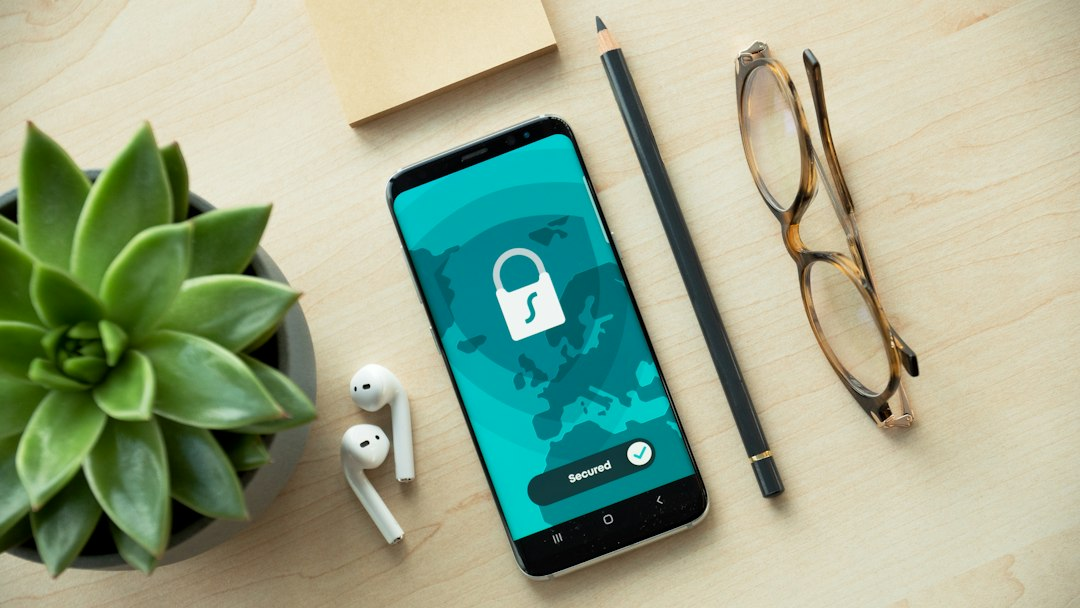 Smartphone beside a padlock symbolizing mobile security