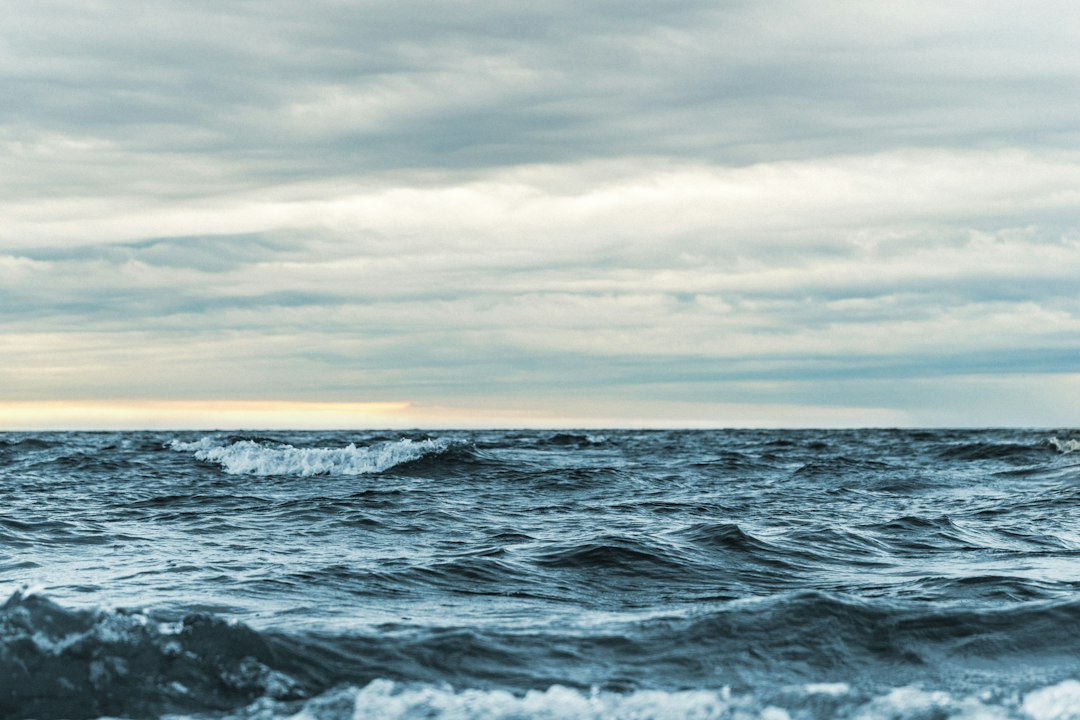 Dark storm clouds over rough ocean waves, illustrating Hurricane Trudy