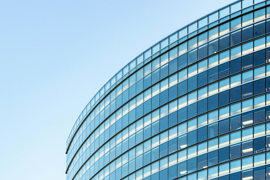 Modern glass office building representing major technology employers