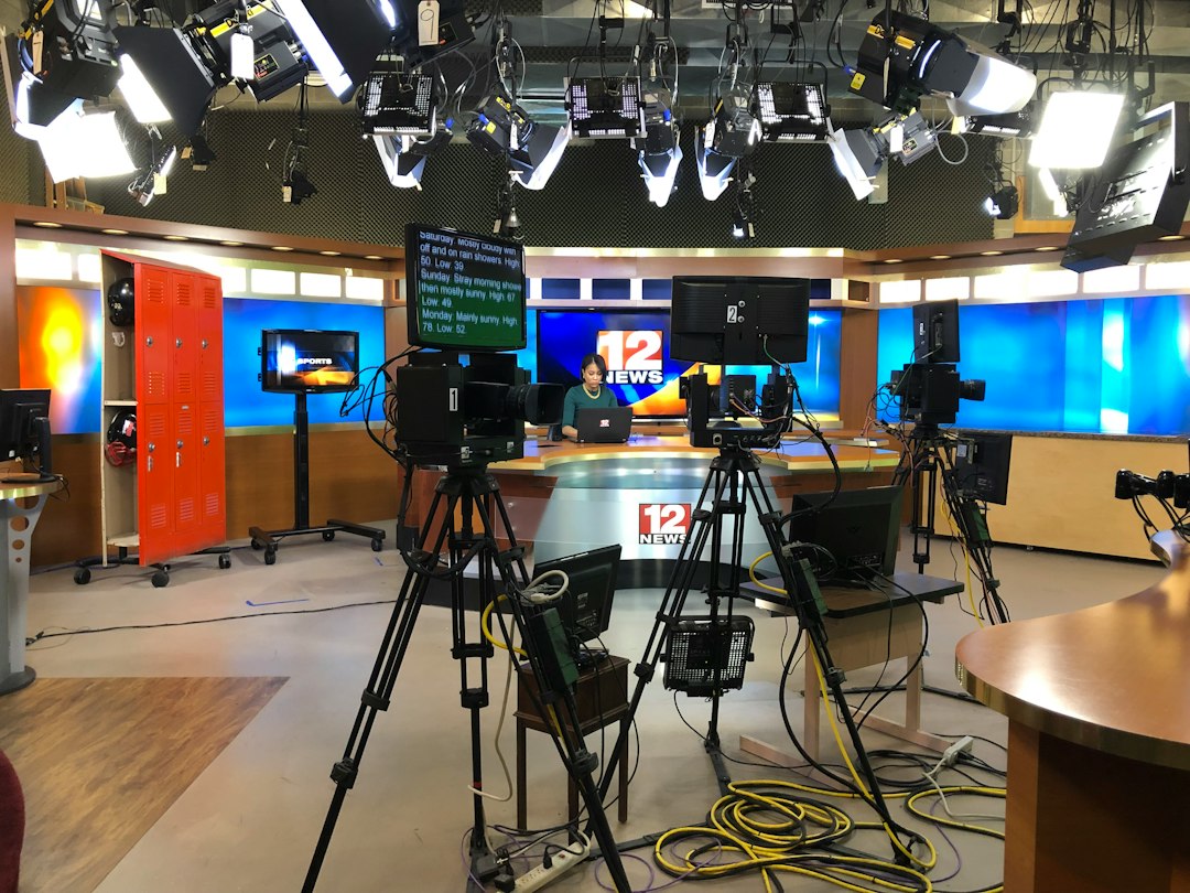 Illustrative television studio with cameras and screens
