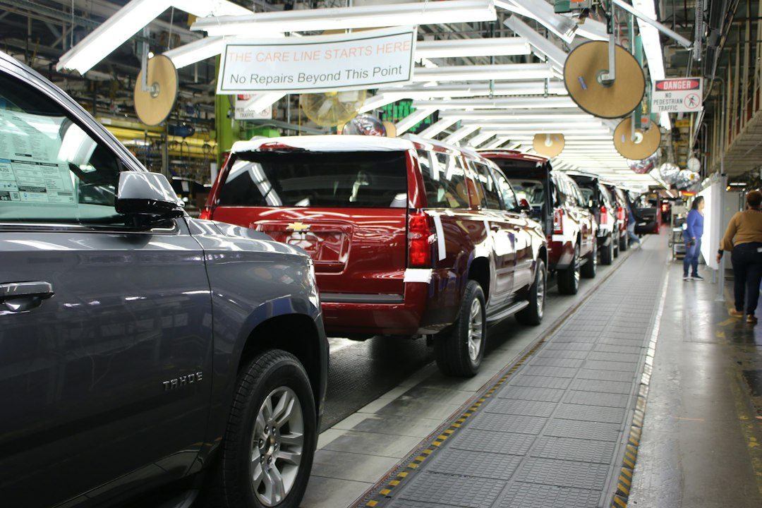 Workers and vehicles on an automotive assembly line, illustrative of the Springfield truck plant